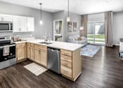 Thumbnail 3 of 35 - A modern kitchen with wooden cabinets and a large island.