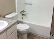 Thumbnail 12 of 15 - Bathroom in the Yeakel Townhome, featuring a white toilet and a sink.