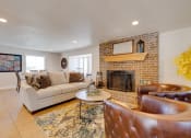Thumbnail 7 of 35 - A classic living room in the clubhouse interior, featuring timeless furniture, comfortable seating arrangements, and tasteful decor, provides a welcoming and cozy communal space for residents to relax and socialize.