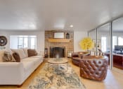 Thumbnail 6 of 35 - A classic living room in the clubhouse interior, featuring timeless furniture, comfortable seating arrangements, and tasteful decor, provides a welcoming and cozy communal space for residents to relax and socialize.