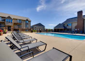 Thumbnail 10 of 35 - A sparkling pool with crystal-clear water beckons residents to enjoy a refreshing swim at the clubhouse.