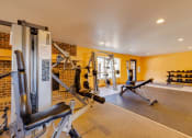 Thumbnail 15 of 35 - Workout area at Olde English Village, showcasing a clean space with cardio and strength-training equipment.