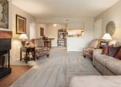 Thumbnail 11 of 16 - Inviting living room with a sofa, coffee table, and decorative accents, creating a relaxed and comfortable space with plenty of natural light.