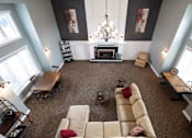 Thumbnail 6 of 17 - Inside the Wilshire clubhouse, showcasing a well-designed lounge area with seating arrangements for residents to socialize.