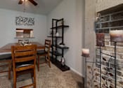 Thumbnail 16 of 17 - Cozy dining area with a wooden table, matching chairs, and soft lighting, creating a welcoming atmosphere for meals.
