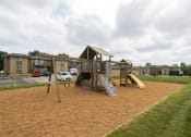Thumbnail 11 of 17 - Colorful playground with various play equipment like slides and swings, offering a fun space for children.