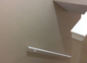Thumbnail 4 of 15 - A stairway leading to the upper level of the Yeakel Townhome, with a white handrail.