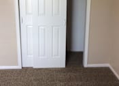 Thumbnail 11 of 15 - A white bedroom door leading to a closet in the Yeakel Townhome.