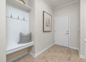 Thumbnail 11 of 43 - a bathroom with a white door and a shelf with a pillow