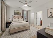 Thumbnail 13 of 43 - a bedroom with a bed and a ceiling fan