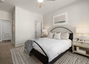 Thumbnail 22 of 43 - a bedroom with a large bed and a closet
