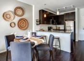 Thumbnail 17 of 28 - dining area and kitchen