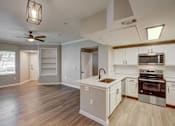 Thumbnail 7 of 37 - A kitchen with a white counter top and stainless steel appliances. at The Fletcher Southlands, Colorado, 80015