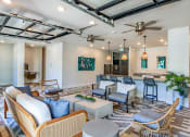 Thumbnail 52 of 69 - a living room with couches and chairs and a bar