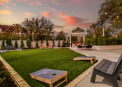 Thumbnail 45 of 69 - a patio with tables and chairs and a lawn