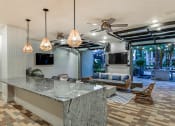 Thumbnail 53 of 69 - a kitchen with a counter top and a living room