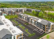 Thumbnail 53 of 65 - an aerial view of a development of apartments with parking lot and trees at Stonehill at West Orange, West Orange, NJ