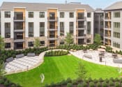 Thumbnail 62 of 65 - an aerial view of an apartment building with a lawn and garden at Stonehill at West Orange, New Jersey, 07052