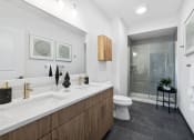 Thumbnail 8 of 65 - a bathroom with a sink and a toilet and a shower at Stonehill at West Orange, West Orange, NJ