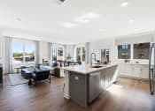 Thumbnail 1 of 65 - a kitchen with a large island in the middle of a living room at Stonehill at West Orange, New Jersey