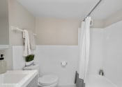 Thumbnail 14 of 14 - a bathroom with a toilet sink and bathtub