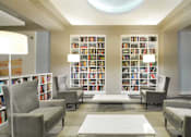 Thumbnail 12 of 17 - a large library with a lot of books at 1841 Columbia Road Apartments, Washington, DC, 20009