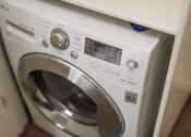 Thumbnail 2 of 13 - a white washer and dryer sitting next to each other