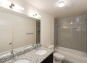 Thumbnail 6 of 13 - a bathroom with a sink toilet and bathtub