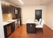 Thumbnail 16 of 25 - a kitchen with a stove top oven next to a sink