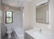Thumbnail 7 of 19 - a bathroom with a toilet sink and bathtub