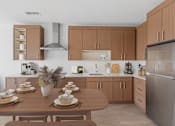 Thumbnail 1 of 66 - A modern kitchen with wooden cabinets and a dining table set for a meal.