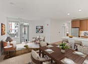 Thumbnail 21 of 66 - A modern dining room with a wooden table and chairs.