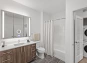 Thumbnail 30 of 66 - A modern bathroom with a wooden vanity and white fixtures.