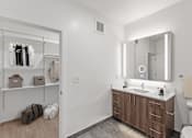 Thumbnail 32 of 66 - A bathroom with a white sink and a mirror above it.