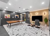 Thumbnail 55 of 66 - A modern office space with a black and white floor design.