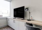 Thumbnail 9 of 17 - a flat screen tv sitting on top of a wooden shelf
