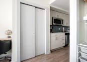 Thumbnail 6 of 17 - a kitchen with a refrigerator freezer next to a stove top oven