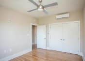 Thumbnail 6 of 19 - an empty room with a ceiling fan and a door