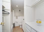 Thumbnail 7 of 14 - a bathroom with a toilet and a sink