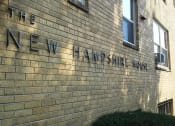 Thumbnail 13 of 16 - a brick wall with the name of the new haven trust on it