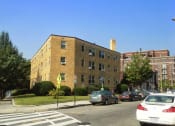 Thumbnail 16 of 16 - an apartment building on the corner of a street