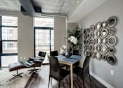 Thumbnail 15 of 16 - a view of a living room with a window and a table at Coda on H Apartments, District of Columbia 20002