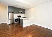 Thumbnail 21 of 22 - a kitchen and dining area in a 555 waverly unit