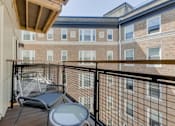 Thumbnail 20 of 22 - a balcony with two chairs and a table