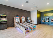 Thumbnail 10 of 47 - Game room with skeeball and arcade machines at The Yancey Apartments, North Carolina, 28217