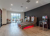 Thumbnail 45 of 47 - Game room with skee ball and arcade machine at The Yancey Apartments, North Carolina