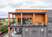 Thumbnail 33 of 47 - Rooftop terrace with covered pavilion and outdoor seating at The Yancey Apartments, Charlotte