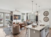 Thumbnail 2 of 41 - A modern kitchen with a dining area and a living room at Vintage Raleigh West Apartments, Raleigh, NC