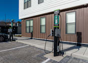 Thumbnail 17 of 30 - A Blink charging station is located outside a building.
