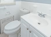 Thumbnail 3 of 10 - a bathroom with a toilet sink and mirror